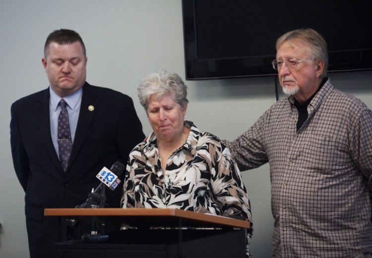 Sanford police Detective Eric Small, left, listens as Kenneth and Sheila Rear make a public plea for information regarding their missing daughter Kerry Rear, who was last seen on Jan. 22 in Sanford.