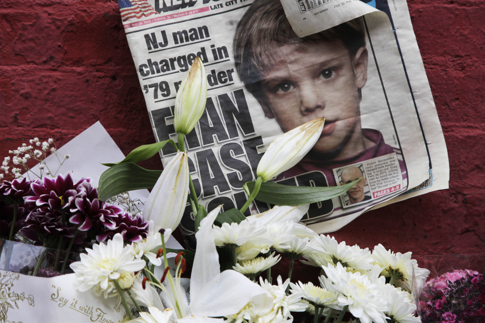 A newspaper is part of a makeshift memorial to Etan Patz in New York City. The anniversary of his disappearance has been designated National Missing Children's Day.