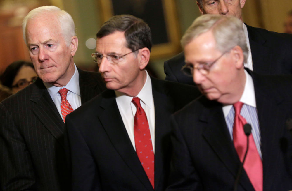 From left, Republican Sens. John Cornyn, John Barrasso and Senate Majority Leader Mitch McConnell speak Friday on the scope of the Intelligence committee's probe into Russian ties.      REUTERS