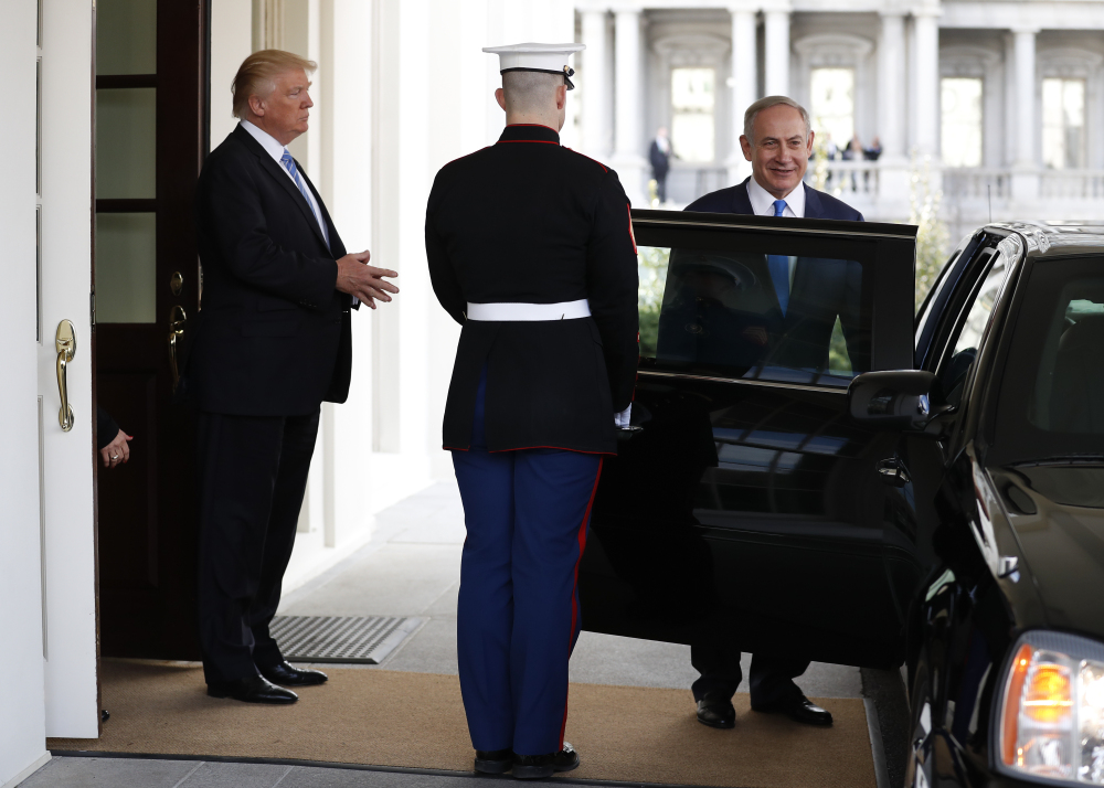 President Trump escorts Israeli Prime Minister Benjamin Netanyahu to his car as he leaves the White House in Washington on Wednesday.
