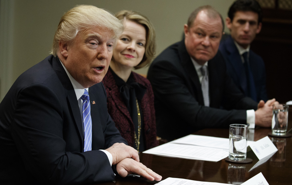 President Trump meets with retail industry leaders Wednesday at the White House. To his left are Jo-Ann Craft Stores CEO Jill Soltau, Gap Inc. CEO Art Peck, and Jeremy Katz, an adviser to National Economic Council Director Gary Cohn. It's not clear whether Trump supports the 'border adjustment' tax idea proposed by Republicans.