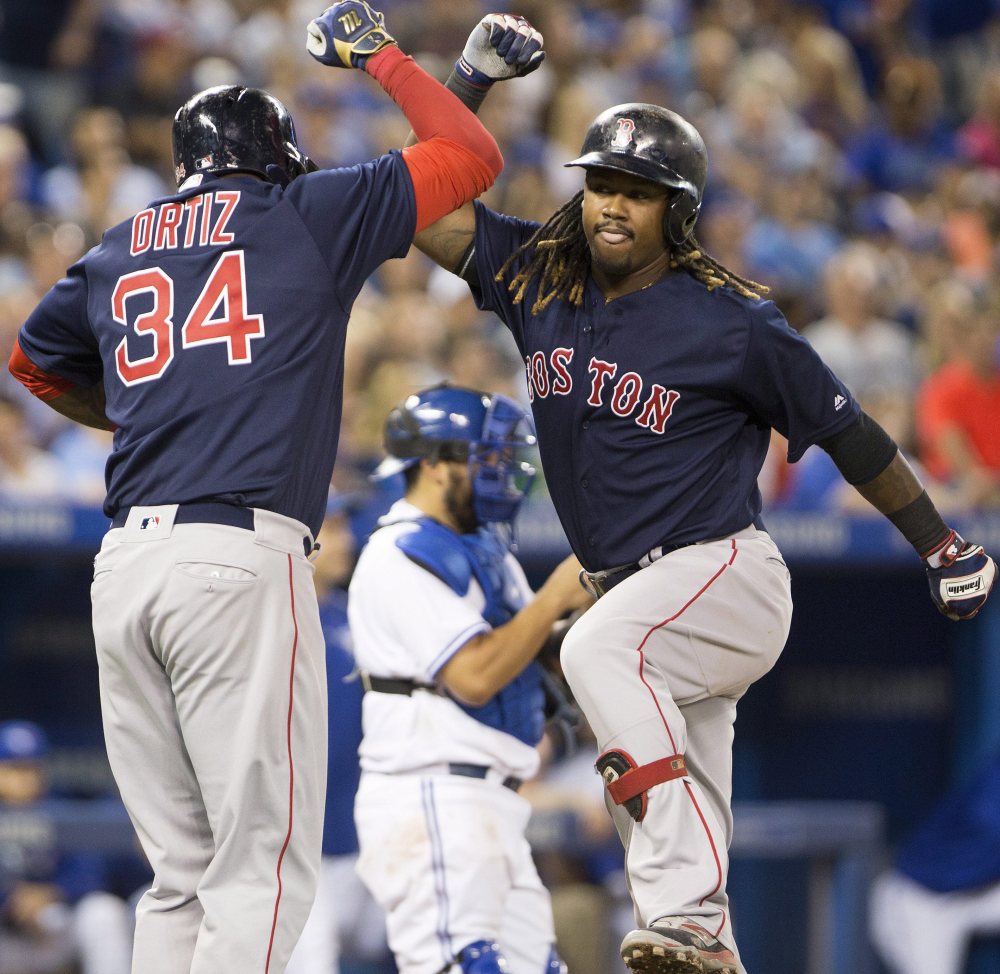 Hanley Ramirez, right, won't be sharing the clubhouse anymore with David Ortiz, yet they not only stay in contact, but Ortiz offers advice on how to approach the role of designated hitter for the Red Sox.