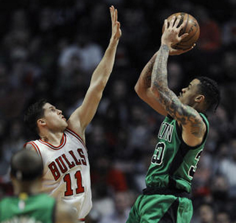 Boston's Gerald Green goes up for a shot against Chicago's Doug McDermott in the first half Thursday night in Chicago.