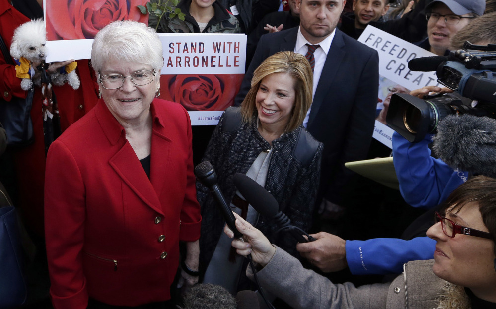 Barronelle Stutzman, left, a Richland, Wash., florist who was fined for denying service to a gay couple in 2013, smiles as she is surrounded by supporters after a hearing Nov. 16, 2016, before Washington's Supreme Court in Bellevue, Wash.
Curt Freed, left, and Robert Ingersoll sued florist Barronelle Stutzman for refusing to provide services for their wedding.