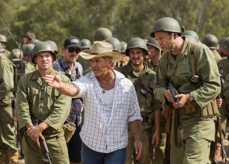 Director Mel Gibson, center, and actor Vince Vaughn work on the set of the film "Hacksaw Ridge." Many thought Gibson's anti-Semitic tirade in 2006, recorded while being arrested on suspicion of drunken driving, was the end to his stardom.