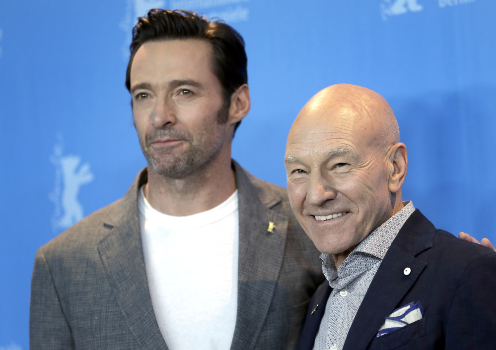 Actors Hugh Jackman, left, and Patrick Stewart pose for photographers during a photo op for the film "Logan" at the 2017 Berlin Film Festival in Berlin, Germany, on Friday.