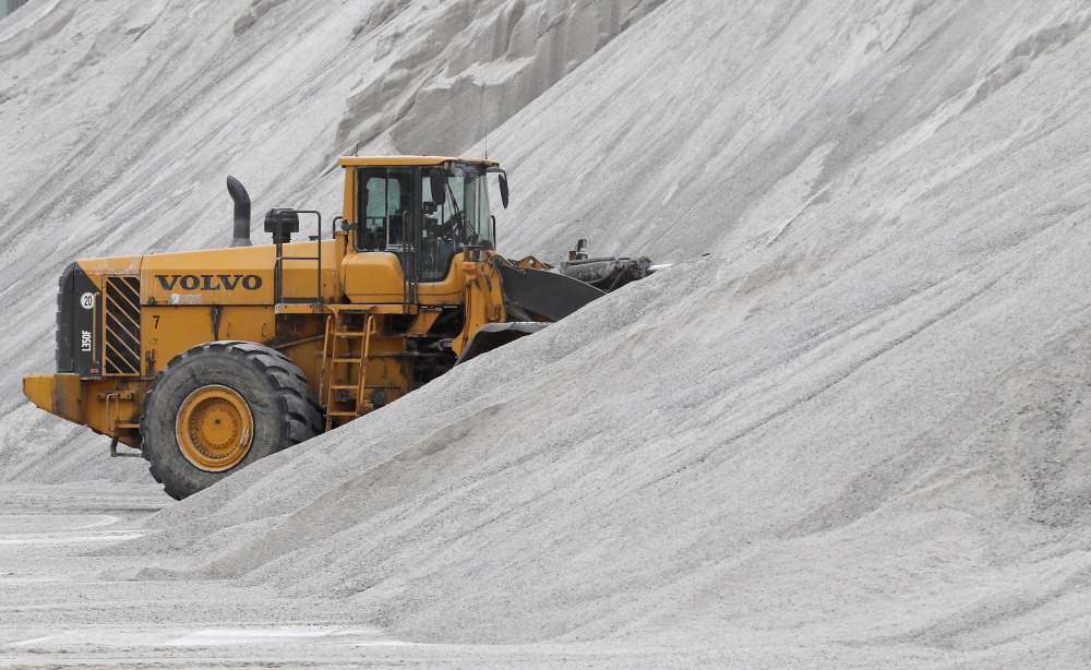 An American Rock Salt Co. loader works a salt pile at the mine in Hampton Corners, N.Y., last month. The company mines a seam of salt left from a massive sea that dried up 400 million years ago.