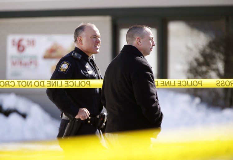 Portland Police Chief Michael Sauschuck, right, stands with another officer at the scene of a police-involved shooting outside Subway on St. John Street on Saturday.