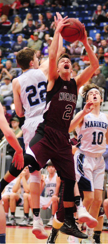 Nokomis' Joshua Smestad, right, grabs a rebound away from Oceanside's Cooper Wirkala, 22, during their Class A North semifinal game Saturday at Augusta Civic Center.