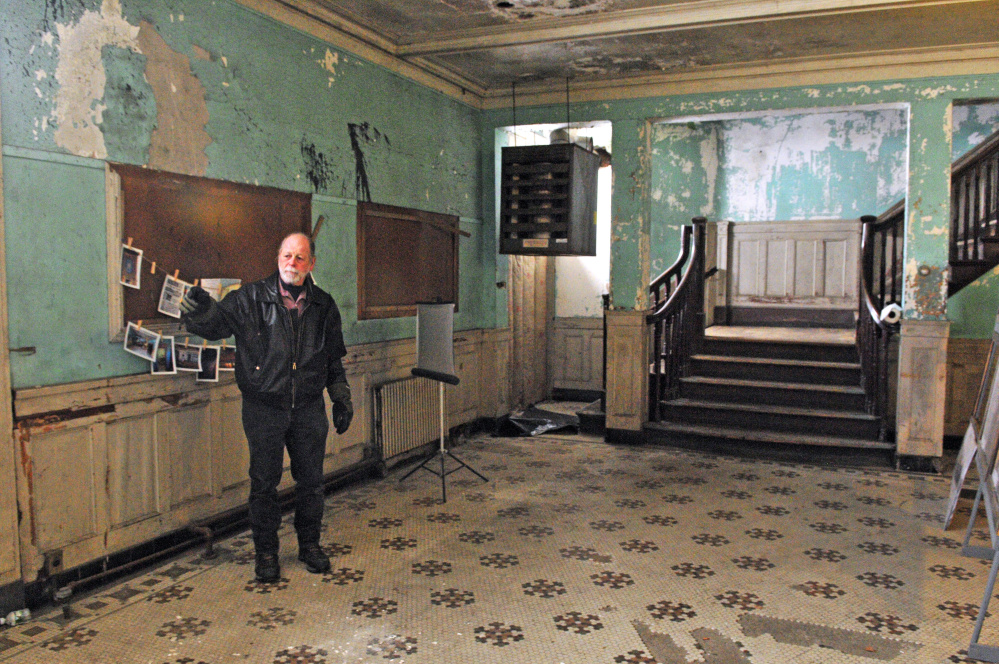 Richard Parkhurst talks about renovation plans during a recent tour of the Colonial Theatre in Augusta.