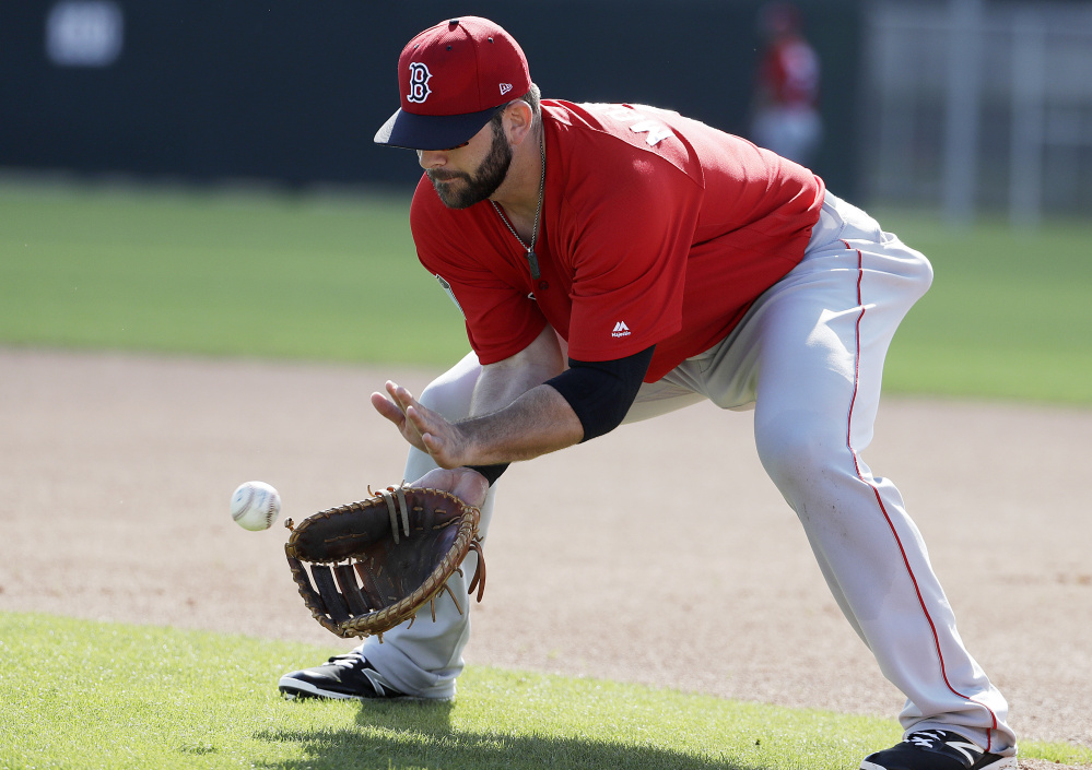 Red Sox first baseman Mitch Moreland fields a ball during a spring training workout Sunday. All eyes will be on the newcomer's bat after the retirement of David Ortiz, but the Red Sox also liked him for his glove.