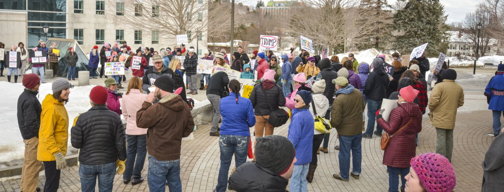 Protesters gather at the State House in Augusta on Monday – Presidents Day – to voice their objections to President Trump.