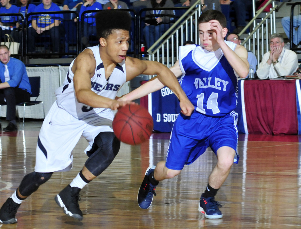 A.R. Gould's John Clement is pressured by Joey Thomas of Valley during a Class D South boys' basketball semifinal Wednesday at the Augusta Civic Center. A.R. Gould won, 76-61.