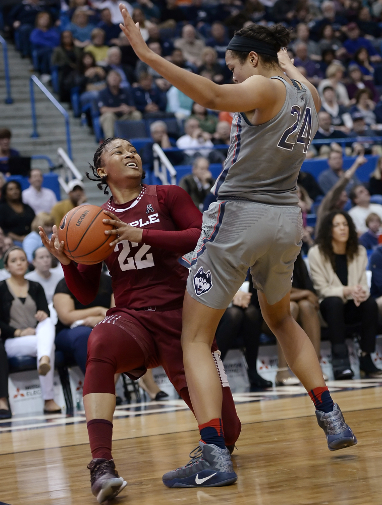 Tanaya Atkinson of Temple finds little room against Napheesa Collier of Connecticut during the first half of UConn's 90-45 victory Wednesday night in Hartford, Connecticut.
