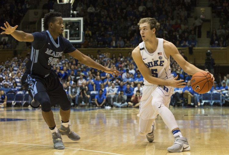 Wes Myers, left, playing earlier this season against Duke, has been suspended indefinitely from the University of Maine men's basketball team after breaking a teammate's jaw.