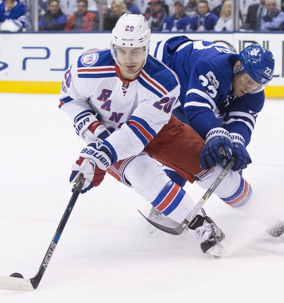 New York Rangers left wing Chris Kreider turns away from Toronto Maple Leafs defenseman Nikita Zaitsev during the first period of Thursday night's matchup of the two Eastern Conference teams in Toronto. The Rangers won, 2-1.