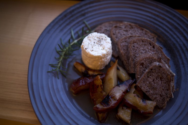 Basket-aged ricotta with grilled bosc pears, grilled bread and rosemary black pepper syrup.