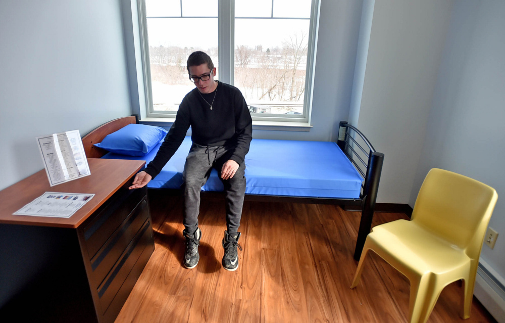 Nicholas Turano, 20, offers a tour on Friday of an apartment he hopes to move into at the Mid-Maine Homeless Shelter in Waterville. He said he believes the shelter is a boon to "youth who need a second shot at life."