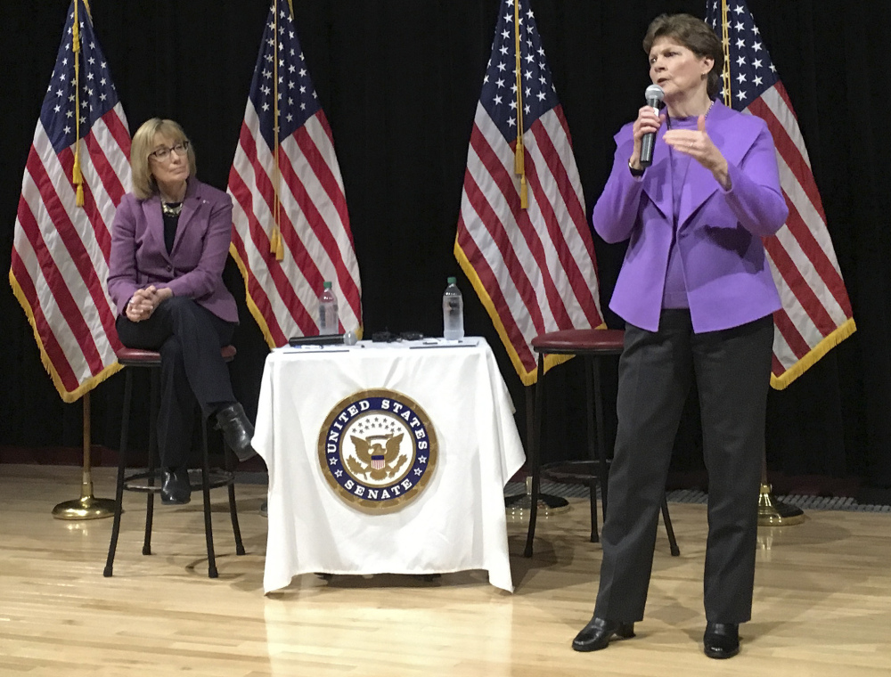 Democrat U.S. Sen. Maggie Hassan, left, listens as Sen. Jeanne Shaheen speaks to constituents during a town hall meeting Friday in Concord, N.H. Shaheen and Hassan took questions and talked about their efforts to fight against the policies President Trump.