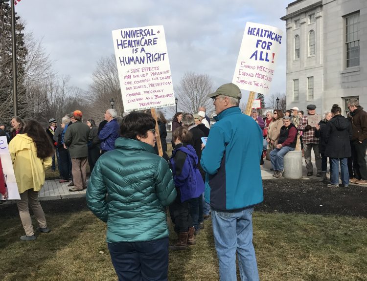 An estimated 200 people rallied near the State House in Augusta in support of the Affordable Care Act, also known as Obamacare, on Saturday.