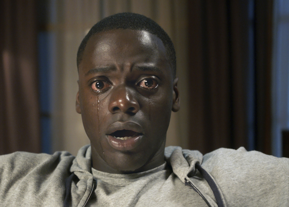 Daniel Kaluuya performs in a scene from the movie thriller "Get Out."