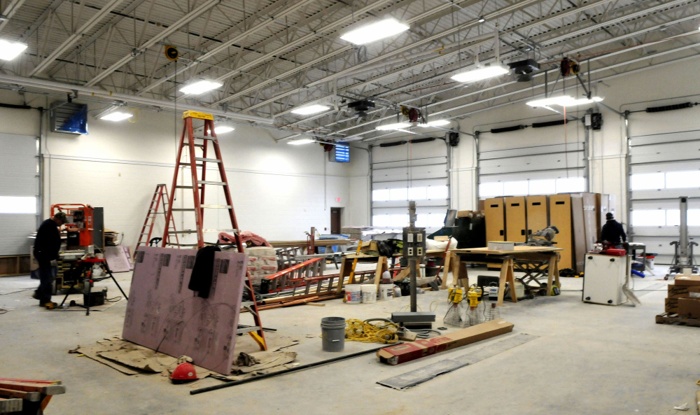 Contractors work inside the new three-bay North Station off Leighton Road in Augusta on Monday. The project with firefighter living quarters, kitchen, equipment and training rooms is scheduled to be completed next month.