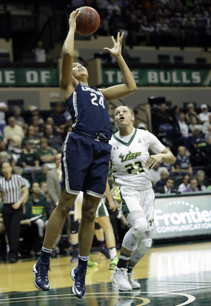 Connecticut's Napheesa Collier goes up for two of her 39 points during a 96-68 win over South Florida at Tampa, Fla., on Monday night.