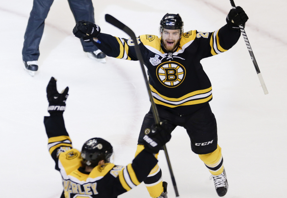 The Bruins' Daniel Paille, right, celebrates a goal by Rich Peverley against the Chicago Blackhawks in Game 4 of the 2013 Stanley Cup finals. Peverley and Chris Kelly were key trade-deadline pickups for the Bruins in 2011, when Boston won the Stanley Cup.
