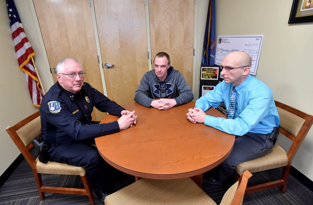 From left, Waterville Police Chief Joseph Massey talks with Officer Chase Fabian and Deputy Chief Bill Bonney about Maine's opioid epidemic. Nearly one Mainer dies a day from drug overdose, the Attorney General's Office says.