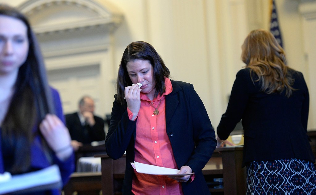 Tonya Dalbo, sister of Michael Moore, one of the two fire victims, wipes away tears after speaking at Dylan Collins' sentencing Monday.