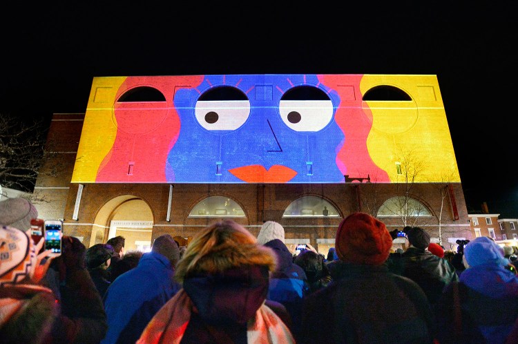 The Portland Museum of Art reopened Friday after being closed for a month, and showed a large-scale animated 3D movie, “Lights Across Congress,” on the museum’s facade facing Congress Street.