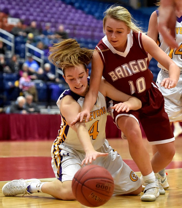 Cheverus' Kaylin Malmquist, 4, battles for the loose ball with Bangor's Lauren Young in the Class AA North quarterfinals at the Augusta Civic Center on Thursday.