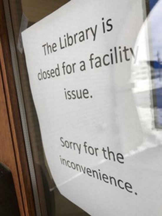 A sign alerted potential library users Wednesday that the building is closed.