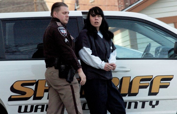 Miranda Hopkins, of Troy, is led into Belfast District Court for an initial appearance Jan. 17 in connection with the death of her 7-week-old son. Hopkins, who has since been freed on bail, pleaded not guilty Friday to a charge of manslaughter related to the death.