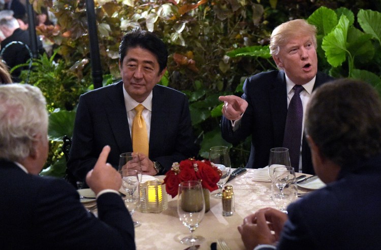 President Trump sits down to dinner with Japanese Prime Minister Shinzo Abe at Mar-a-Lago in Palm Beach, Fla., on Friday, Feb. 10.