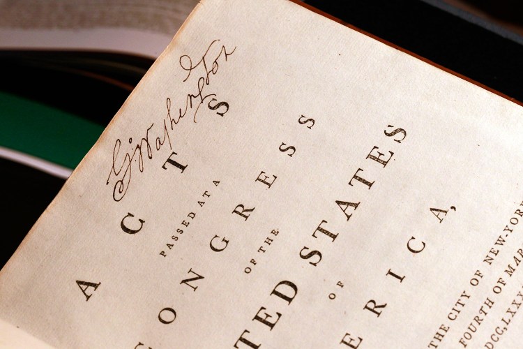 George Washington's signature is visible on his personal copy of the Acts of the first Congress (1789), containing the U.S. Constitution and the proposed Bill of Rights.