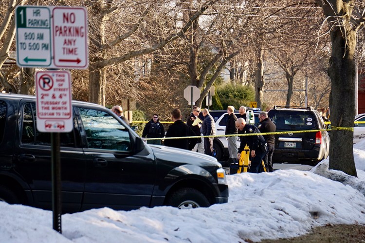 Portland Police crowd the scene on Chadwick Street in the city's West End where a man died Monday afternoon. Police are classifying the man's death as a homicide.