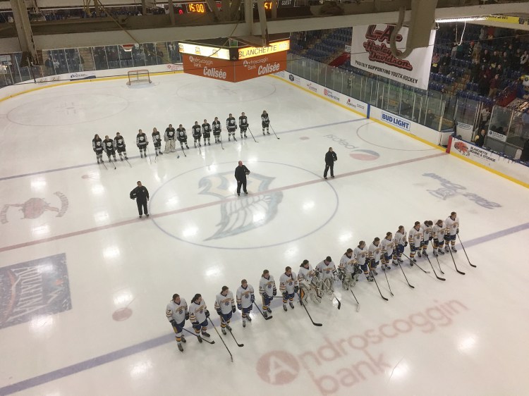Falmouth, in front, and St. Dom's line up before the start of the girls state championship in Lewiston.


