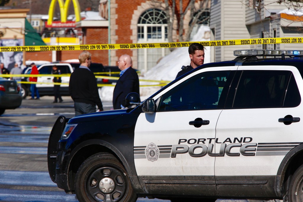 Police officers block off the scene where an officer shot Chance Baker at Union Station Plaza in Portland in February.