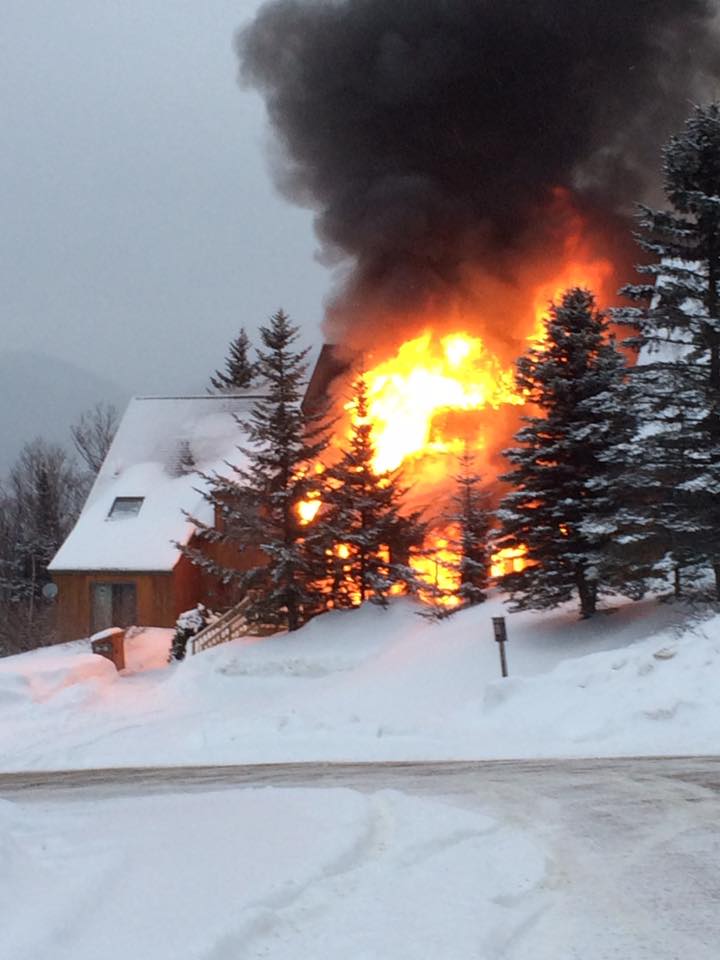 A condominium building burns Tuesday at Saddleback Mountain.