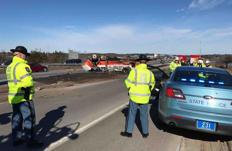 State police work at the scene of Monday's truck crash on Interstate 295.
