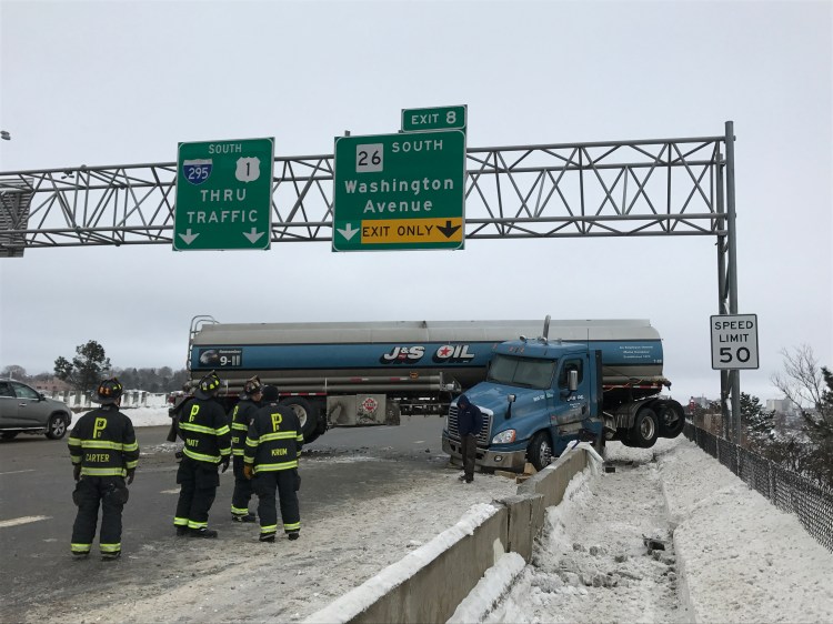 This tanker truck jackknifed and crashed into the pedestrian path in the southbound lanes of I-295 on Tukey's Bridge in Portland on Sunday.