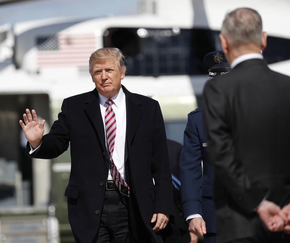President Trump approaches Defense Secretary Jim Mattis before they board Air Force One at Andrews Air Force Base, Md., on Thursday. Trump traveled Virginia to meet with sailors and shipbuilders aboard the Gerald R. Ford CVN 78 aircraft carrier, a $12.9 billion warship, that is expected to be commissioned this year.