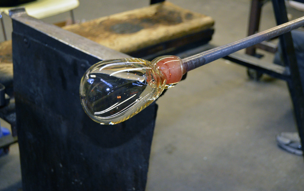 A hot glass bubble — shown here — is the first step and the foundation of all glass blowing work.