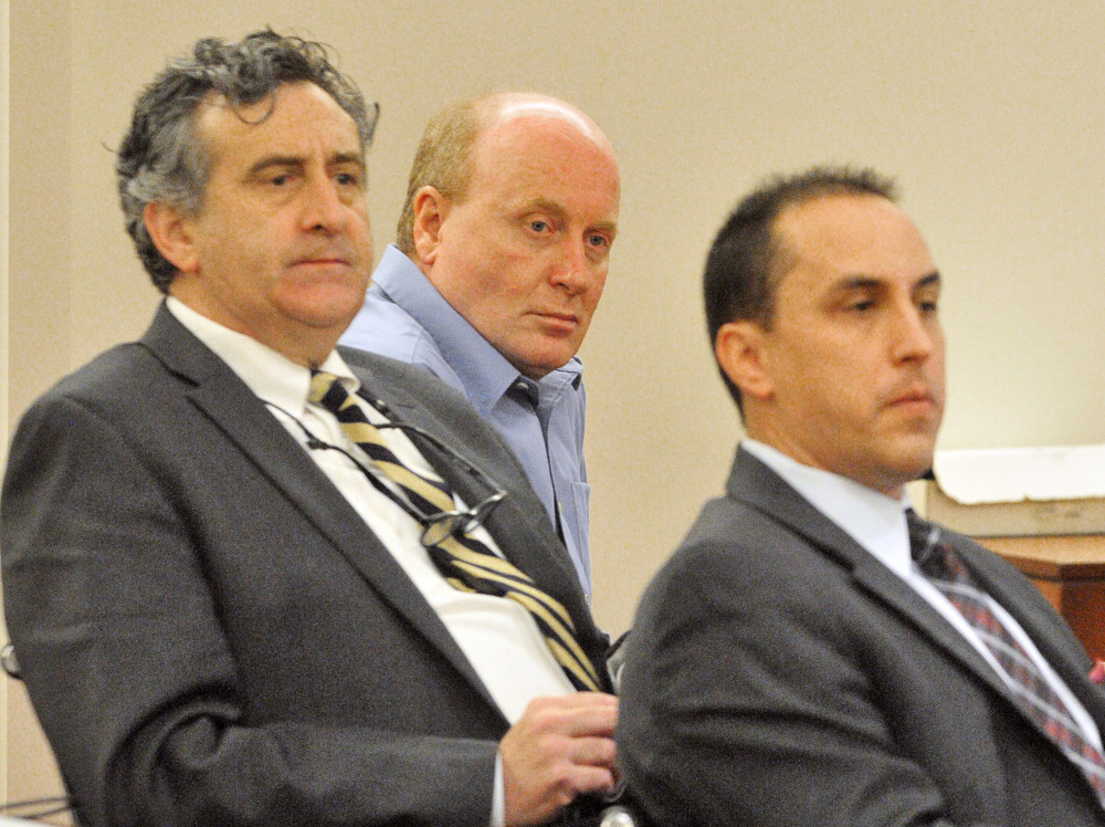 Roland Cummings, center, is flanked by his defense attorneys, Ronald Bourget, left, and Darrick Banda, in the Capital Judicial Center in Augusta during his trial in November 2015, when he was found guilty of murder.