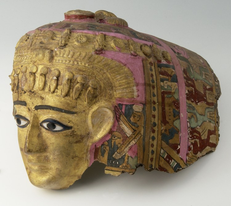 Mummy mask of a woman, Egyptian (Roman), ca. 1st century B.C.–1st century A.D., cartonnage with gold leaf, paint, agate eyes.