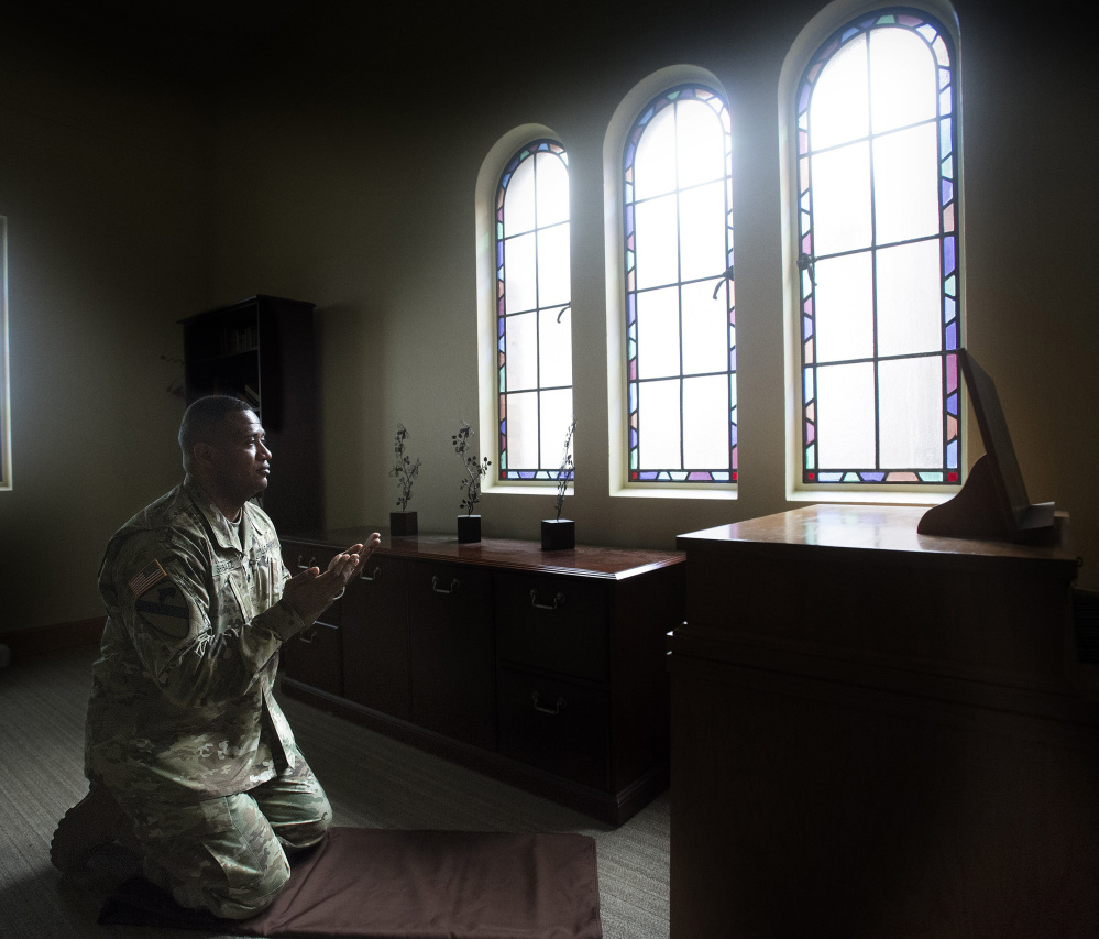 Army Lt. Col. Khallid Shabazz prays five time a day as an Islamic chaplain at the Main Post Chapel on Joint Base Lewis-McChord near Tacoma, Wash.
