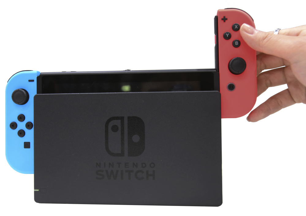 Nintendo's new Switch device, with its twin versatile Joy-Con controllers, aims at to appeal to gamers who like to play both at home and on the road.