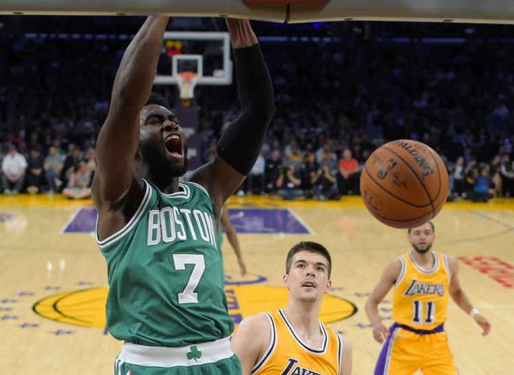 Celtics forward Jaylen Brown dunks against Lakers center Ivica Zubac, center, and guard Tyler Ennis in the first half of the Celtics' win Friday night in Los Angeles. Brown finished with 16 points.