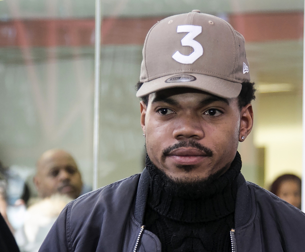 Chance the Rapper leaves a meeting with Illinois Gov. Bruce Rauner on Friday.
